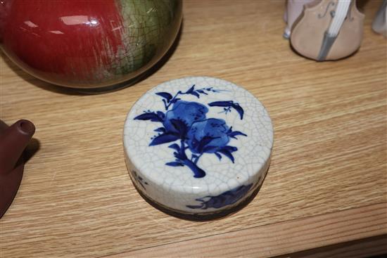 A Chinese squat baluster vase, crackle-glazed in green and red, a blue and white ginger jar and cover and a redware teapot